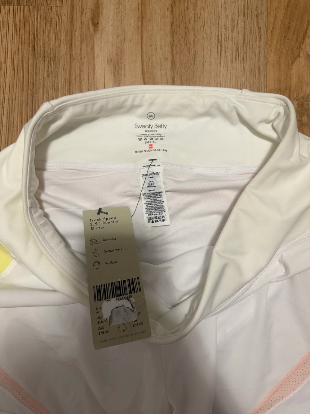 Sweaty Betty White Athletic Shorts with Pink and Yellow Accents - Picture 5 of 5